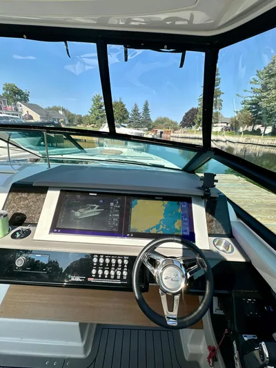  Yacht Photos Pics 2021 Sea Ray SLX 400 Outboard helm with advanced navigation system and steering wheel.