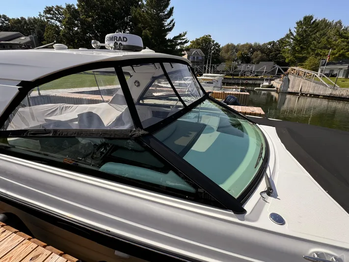  Yacht Photos Pics 2021 Sea Ray SLX 400 Outboard docked, showcasing sleek design and spacious interior.