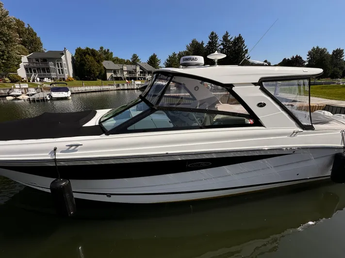  Yacht Photos Pics 2021 Sea Ray SLX 400 Outboard boat docked in a serene marina setting.