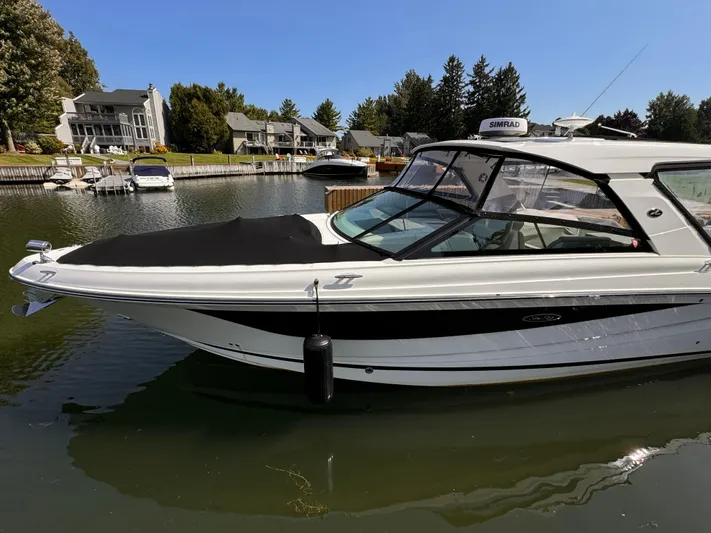  Yacht Photos Pics 2021 Sea Ray SLX 400 Outboard boat docked in a scenic marina.