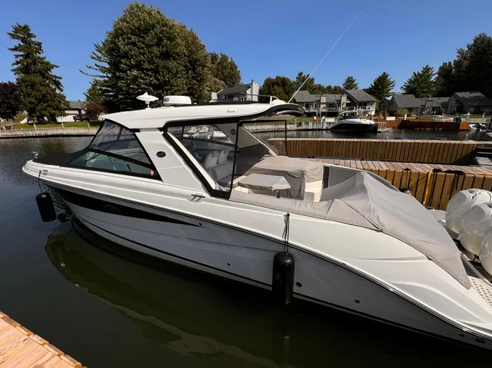  Yacht Photos Pics 2021 Sea Ray SLX 400 Outboard docked in a serene marina setting.