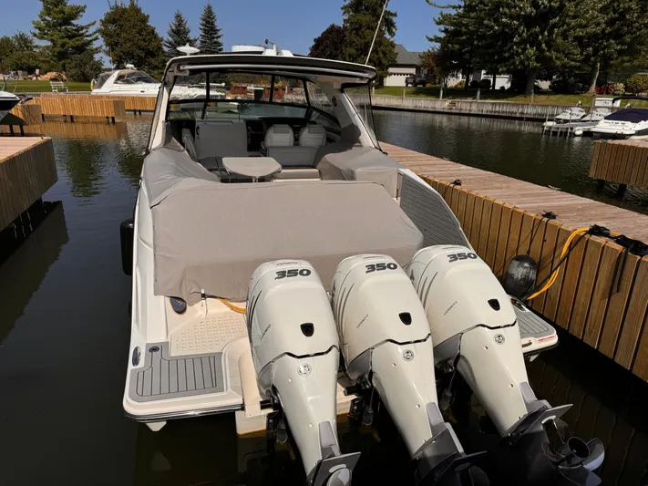 Yacht Photos Pics 2021 Sea Ray SLX 400 Outboard with triple engines docked at marina.