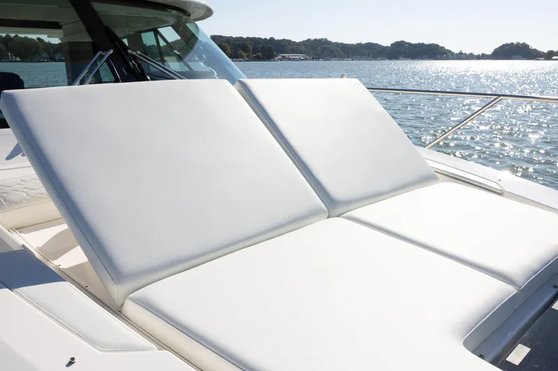  Yacht Photos Pics 2025 Tiara Yachts 43 LE sun deck with luxurious white cushions on a sunny day.