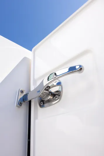  Yacht Photos Pics Chrome handle on 2025 Tiara Yachts 43 LE against clear blue sky.