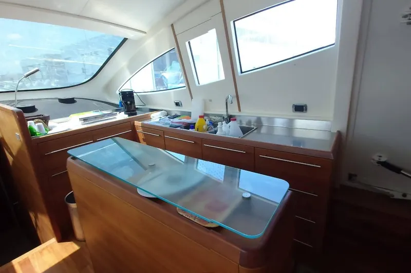  Yacht Photos Pics Luxurious interior of 2007 Aicon 64 yacht with modern kitchen amenities.