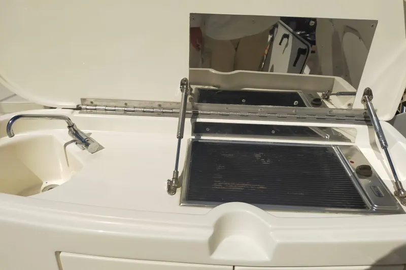  Yacht Photos Pics Outdoor kitchen setup on a 2007 Aicon 64 yacht with sink and grill.