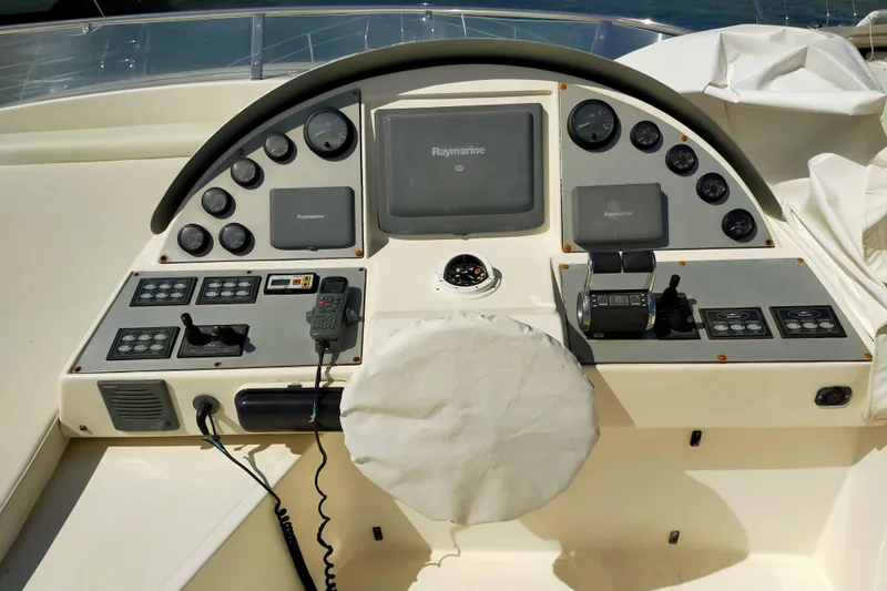  Yacht Photos Pics Control panel of a 2007 Aicon 64 yacht with navigation instruments and controls.