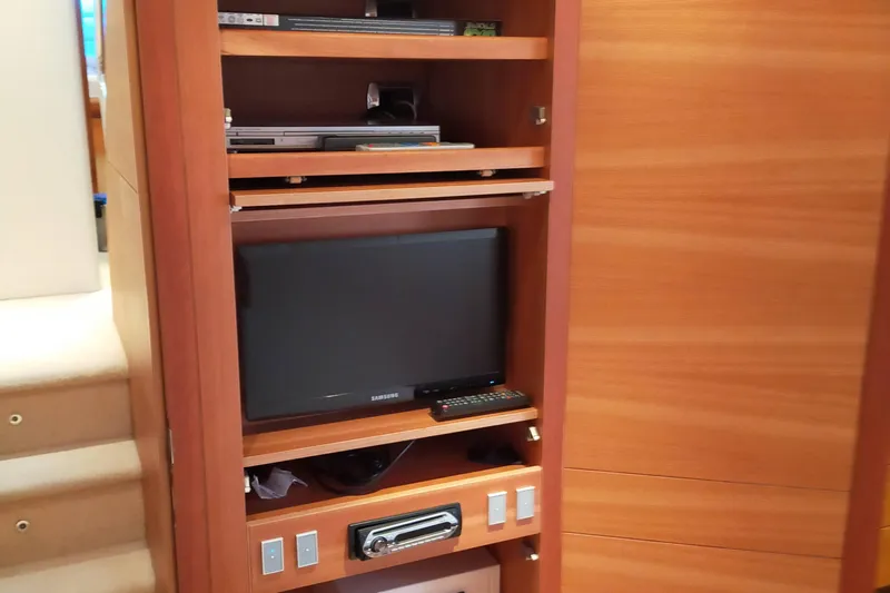  Yacht Photos Pics Entertainment system in 2007 Aicon 64 yacht with Samsung TV and wooden cabinetry.