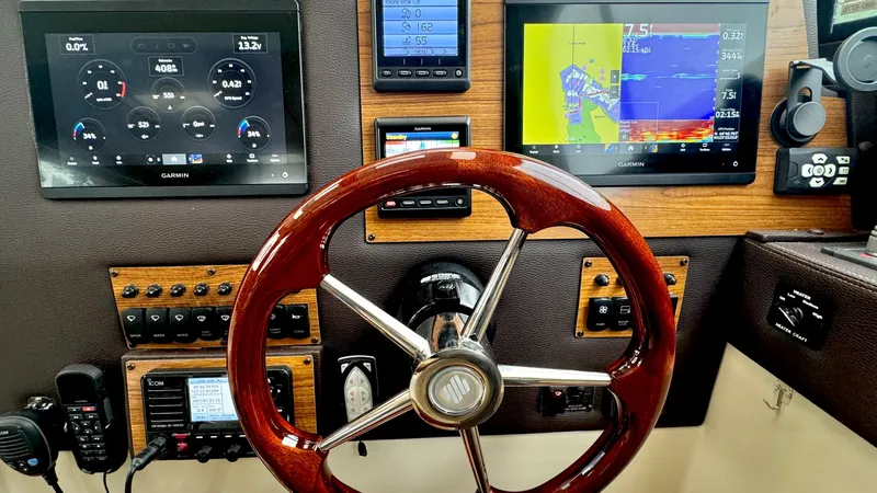  Yacht Photos Pics Ranger Tugs R-29 S 2023 helm with modern navigation instruments.