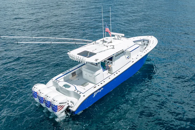  Yacht Photos Pics 2023 Yellowfin 39 Offshore boat on open water, featuring quad Mercury engines.