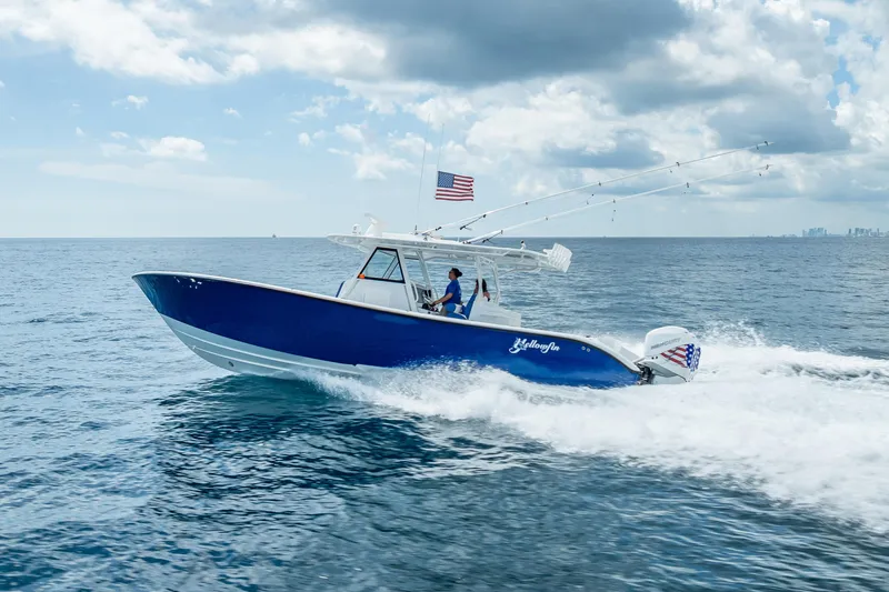  Yacht Photos Pics 2023 Yellowfin 39 Offshore boat cruising on open ocean under cloudy sky.