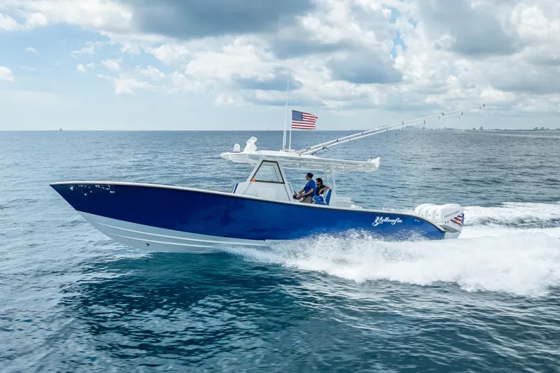  Yacht Photos Pics 2023 Yellowfin 39 Offshore boat cruising on open water under cloudy skies.