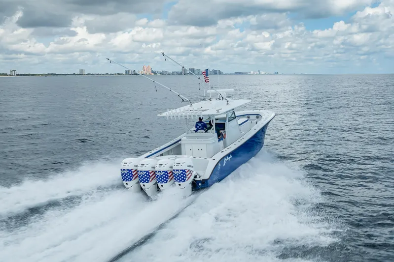  Yacht Photos Pics 2023 Yellowfin 39 Offshore boat cruising on open water under cloudy sky.