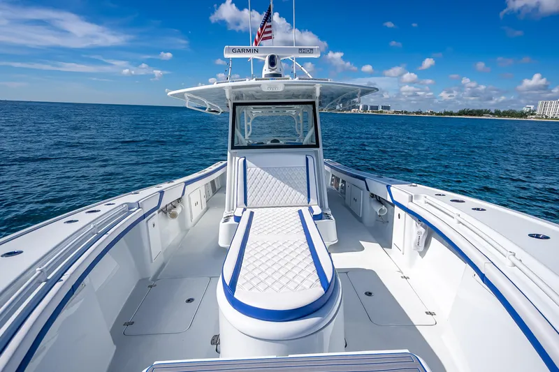  Yacht Photos Pics 2023 Yellowfin 39 Offshore boat on open water, featuring sleek design and spacious deck.