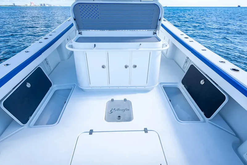  Yacht Photos Pics 2023 Yellowfin 39 Offshore boat deck with storage compartments, open sea view.