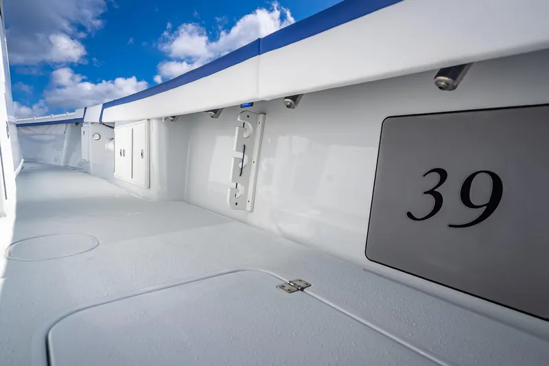  Yacht Photos Pics 2023 Yellowfin 39 Offshore boat deck with clear blue sky background.