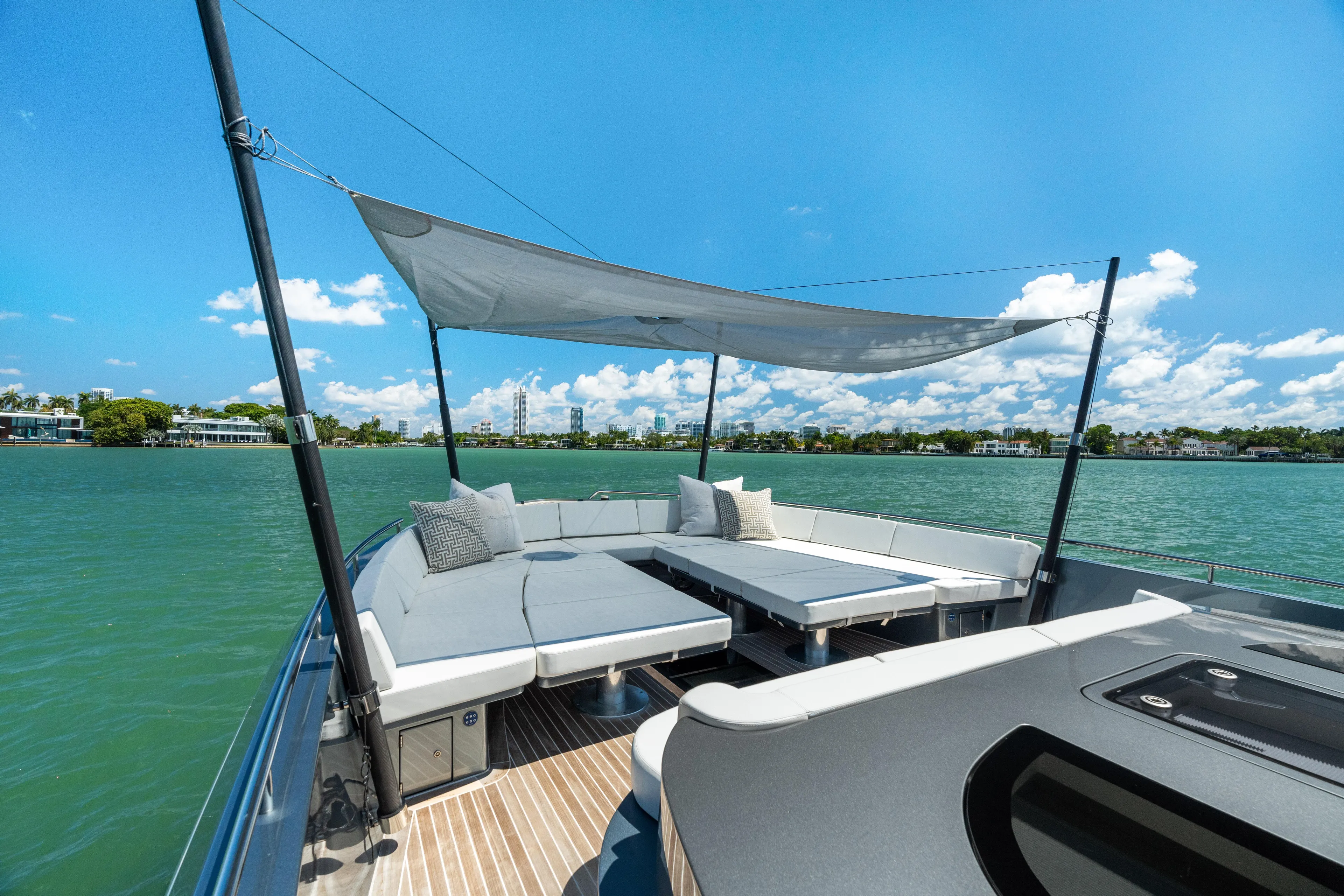 Pura Vida Yacht Photos Pics Luxurious 2024 CNM CONTINENTAL 54 SuperSport yacht with spacious deck and sunshade on open water.