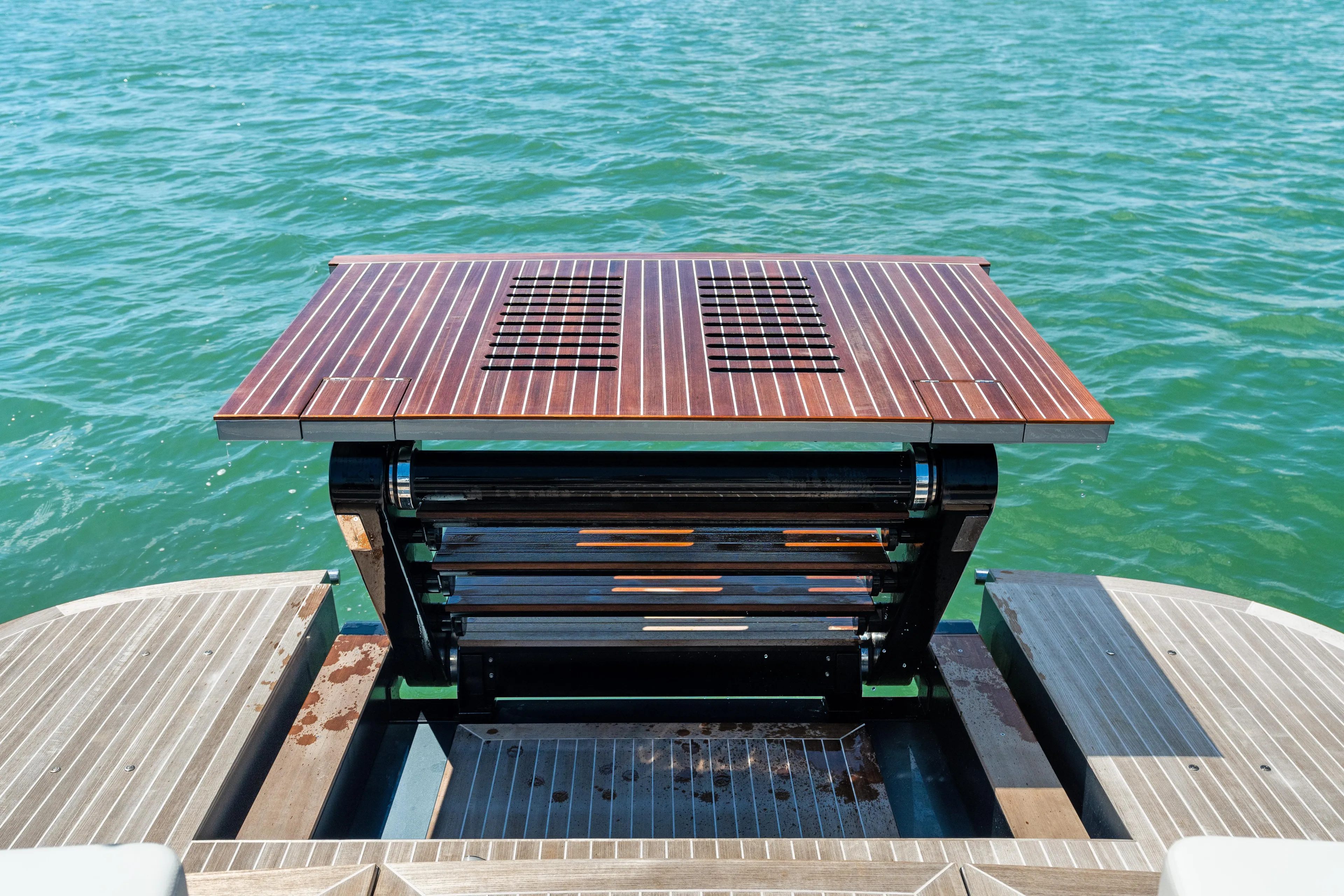 Pura Vida Yacht Photos Pics 2024 CNM CONTINENTAL 54 SuperSport yacht with a retractable deck feature on the water.