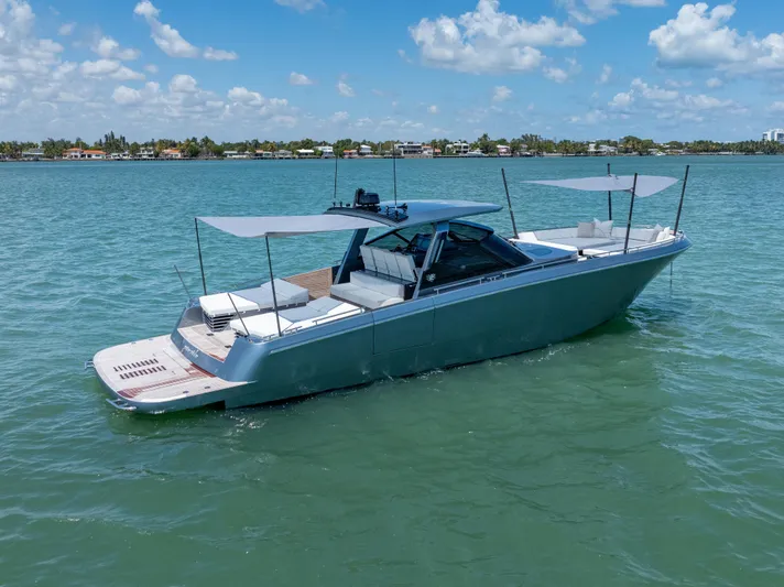 Pura Vida Yacht Photos Pics 2024 CNM CONTINENTAL 54 SuperSport yacht on calm water under blue sky.