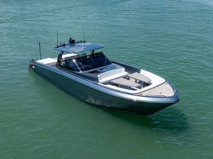 Pura Vida Yacht Photos Pics 2024 CNM CONTINENTAL 54 SuperSport yacht on calm water, showcasing sleek design and luxury features.