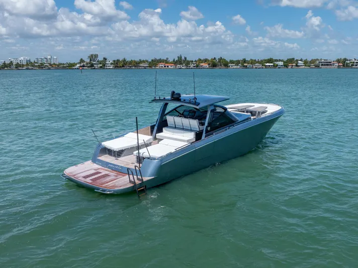 Pura Vida Yacht Photos Pics 2024 CNM CONTINENTAL 54 SuperSport yacht on calm water under blue sky.