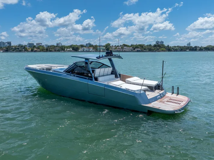 Pura Vida Yacht Photos Pics 2024 CNM CONTINENTAL 54 SuperSport yacht on calm water under blue sky.