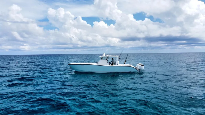  Yacht Photos Pics 2025 Insetta 35IFC boat on open ocean under cloudy sky.