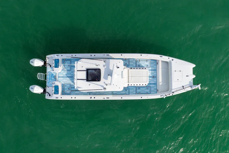  Yacht Photos Pics Aerial view of 2025 Insetta 35IFC boat on green water.