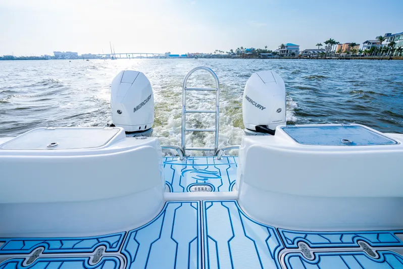  Yacht Photos Pics 2025 Insetta 35IFC boat with dual Mercury engines on a sunny day.