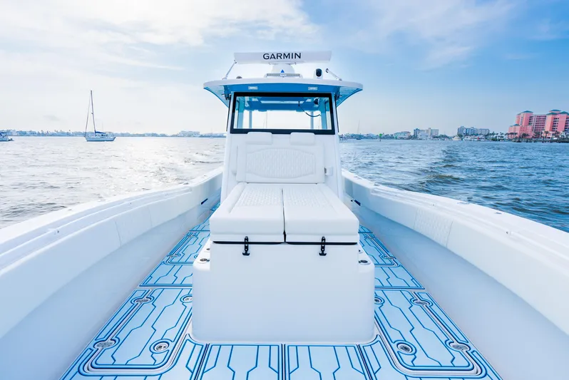  Yacht Photos Pics 2025 Insetta 35IFC boat on water, featuring sleek design and modern navigation equipment.