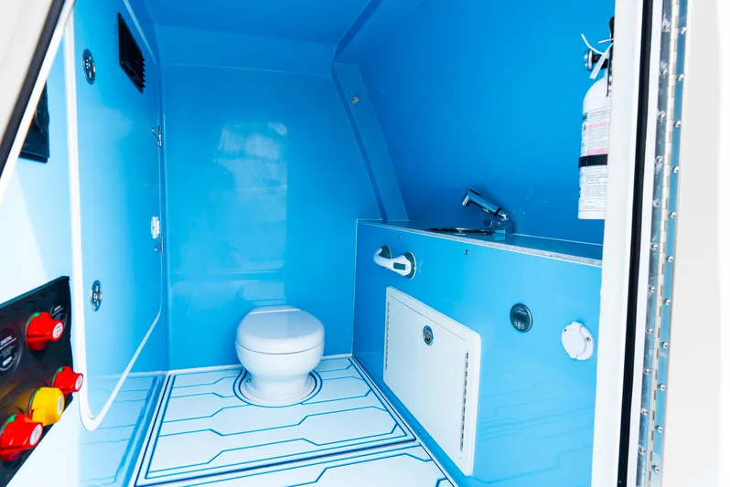  Yacht Photos Pics 2025 Insetta 35IFC boat interior bathroom with blue design and modern fixtures.