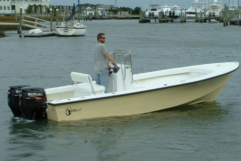 Manufacturer Provided Image: 2026 C-Hawk 23 Center Console boat with Suzuki outboard motor on calm water.