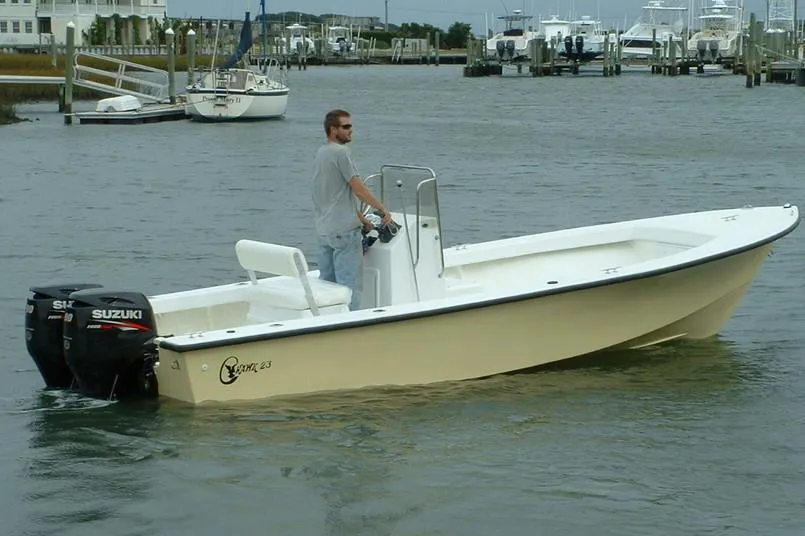 Manufacturer Provided Image: 2026 C-Hawk 23 Center Console boat with Suzuki outboard motor on calm water.