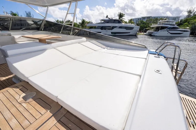 Prana Yacht Photos Pics Luxurious 1995 Itama 46 yacht with spacious sunbathing deck and scenic marina view.