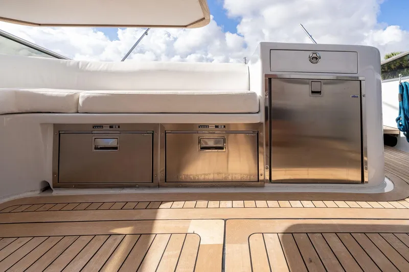 Prana Yacht Photos Pics Luxury Itama 46 yacht deck with stainless steel storage, 1995 model, featuring teak flooring.