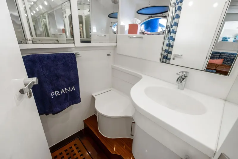 Prana Yacht Photos Pics Luxurious bathroom in a 1995 Itama 46 yacht, featuring modern fixtures and elegant design.