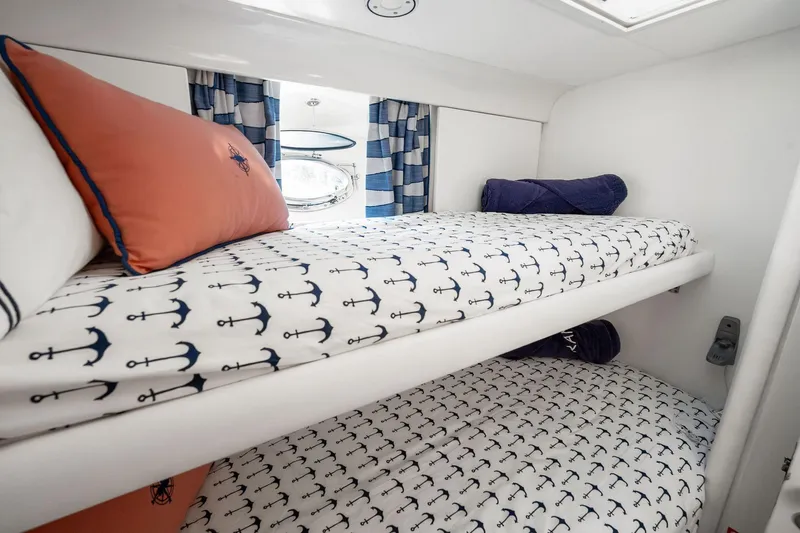 Prana Yacht Photos Pics Cozy cabin with anchor-themed bedding in a 1995 Itama 46 yacht.