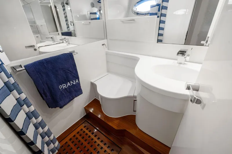 Prana Yacht Photos Pics Luxurious bathroom in 1995 Itama 46 yacht with modern fixtures and elegant design.