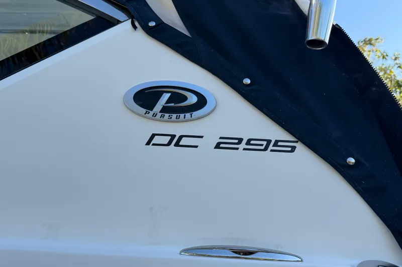  Yacht Photos Pics 2017 Pursuit DC 295 Dual Console boat logo and model name on hull.