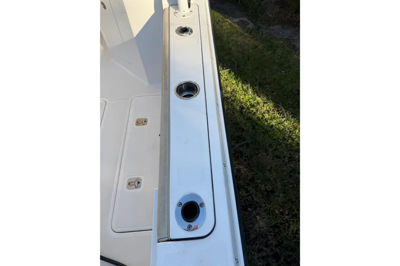  Yacht Photos Pics 2017 Pursuit DC 295 Dual Console boat deck with rod holders and storage compartments.