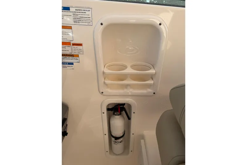  Yacht Photos Pics 2017 Pursuit DC 295 Dual Console interior with cup holders and fire extinguisher.