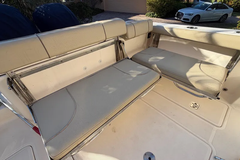  Yacht Photos Pics 2017 Pursuit DC 295 Dual Console boat with beige seating and foldable benches.