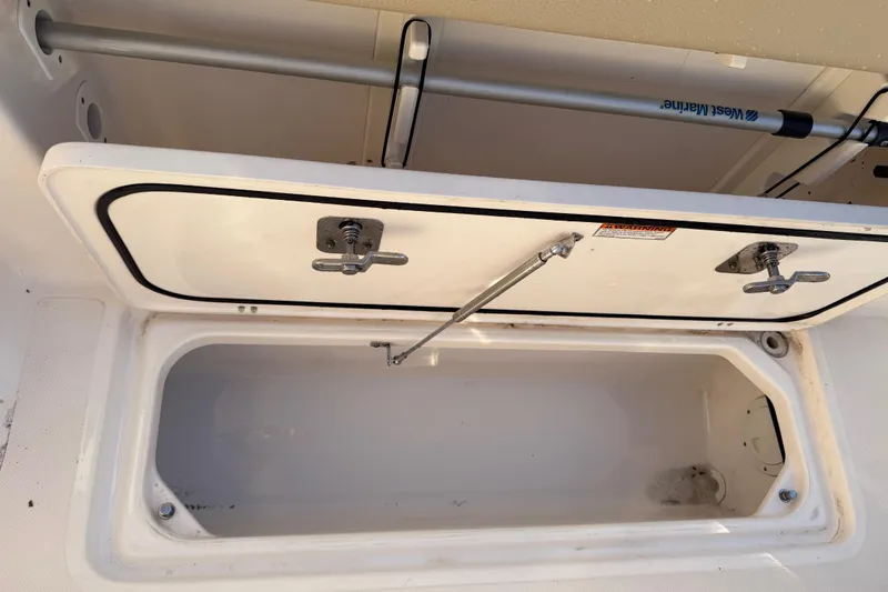  Yacht Photos Pics Open storage compartment on a 2017 Pursuit DC 295 Dual Console boat.