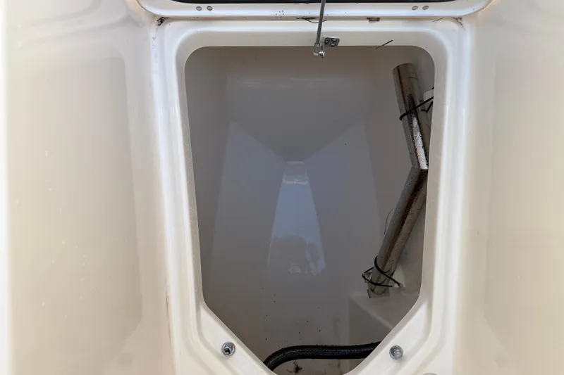  Yacht Photos Pics Storage compartment of 2017 Pursuit DC 295 Dual Console boat, showing interior details.