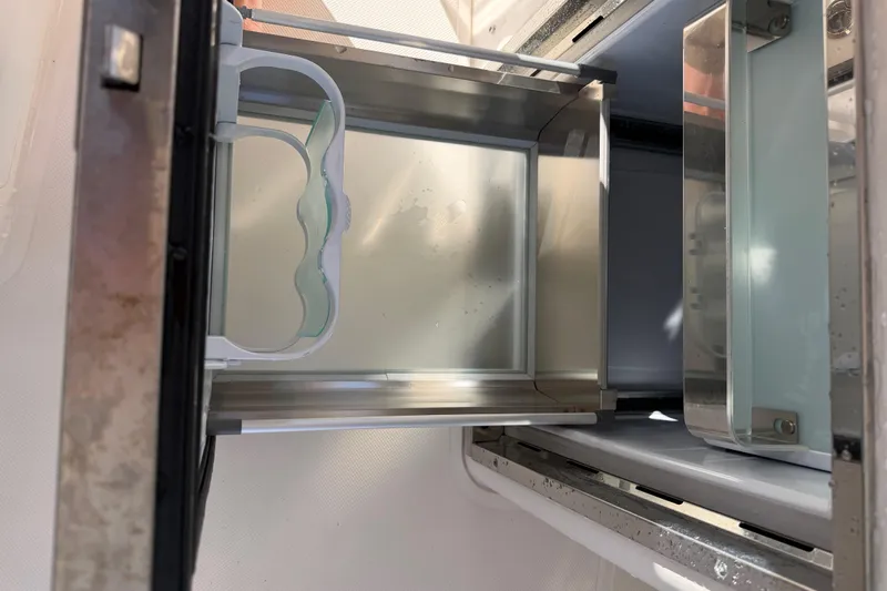  Yacht Photos Pics Open storage compartment in 2017 Pursuit DC 295 Dual Console boat.