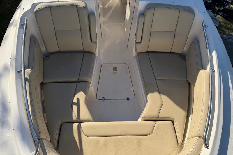  Yacht Photos Pics 2017 Pursuit DC 295 Dual Console boat interior with beige seating and spacious layout.