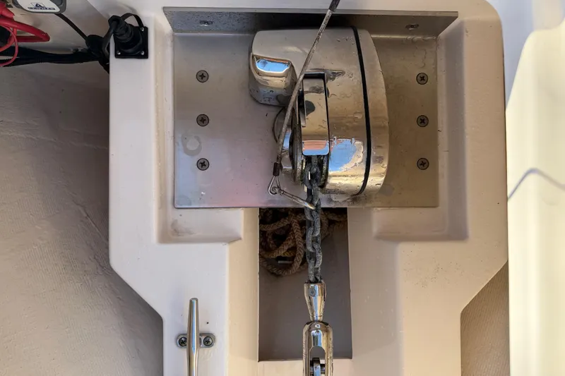  Yacht Photos Pics Anchor winch on 2017 Pursuit DC 295 Dual Console boat, featuring stainless steel components.