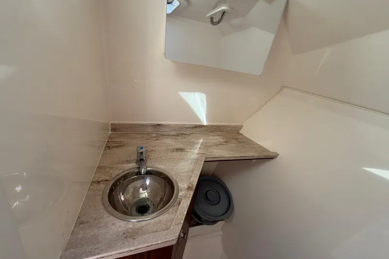  Yacht Photos Pics 2017 Pursuit DC 295 Dual Console boat interior with sink and countertop.