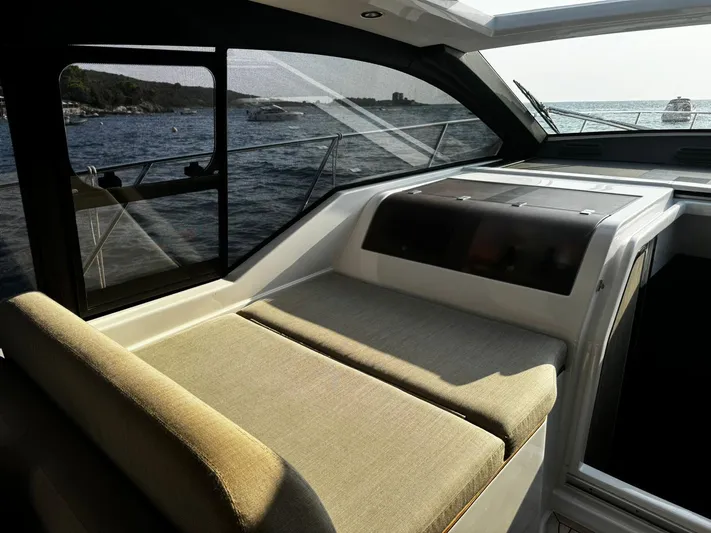  Yacht Photos Pics Interior view of 2022 Azimut Atlantis 51 yacht with comfortable seating and ocean backdrop.