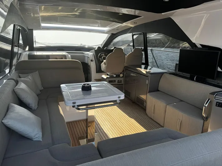  Yacht Photos Pics Luxurious interior of 2022 Azimut Atlantis 51 yacht with modern seating and sleek design.
